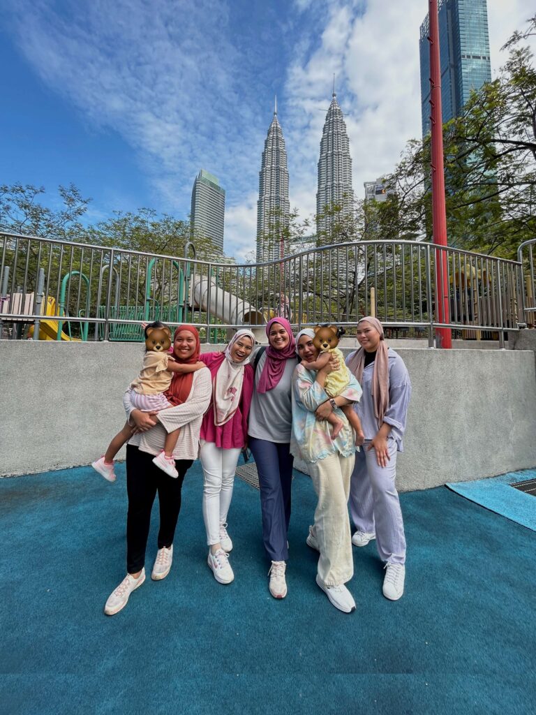 a group of mom friends with their toddlers at the KLCC park playground 