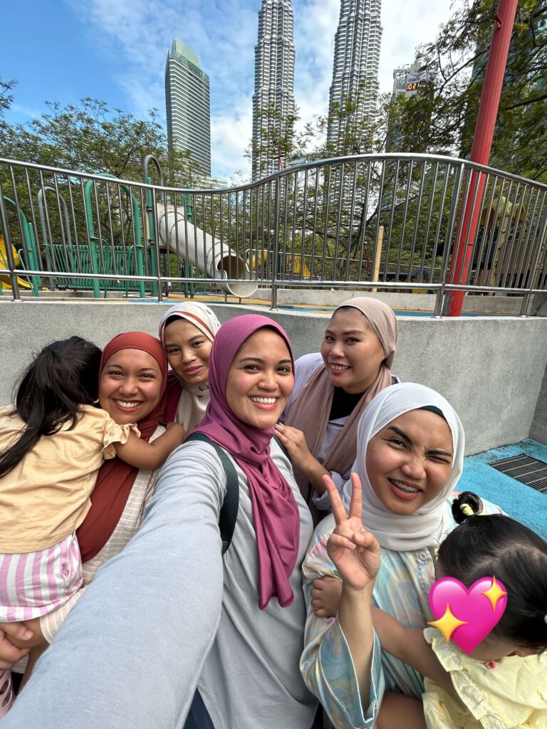 group of mom friends with their kids at KLCC park playground 